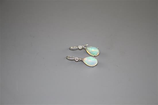 A pair of white metal, pear shaped white opal and diamond set drop earrings, opals approx. 12mm, gross weight 2.7 grams.